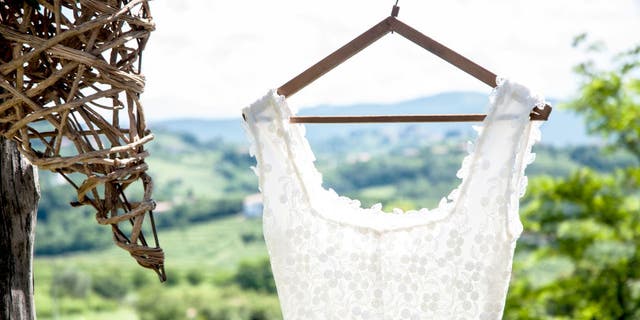 Nicole Pellegrino, the co-host of the Betches Brides Podcast, offers advice on how brides can avoid wedding dress regret.