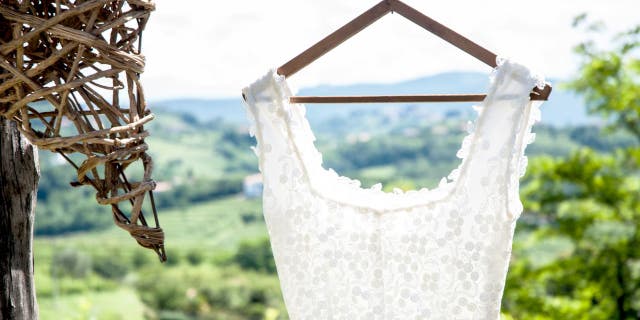 Nicole Pellegrino, the co-host of the Betches Brides Podcast, offers advice on how brides can avoid wedding dress regret.