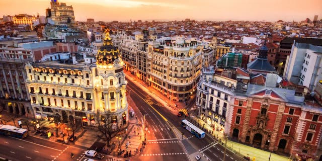 Aerial view of Gran Via in Madrid at dusk from Circulo de Bellas artes. Spain