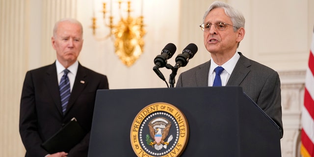 President Joe Biden, left, listens as Attorney General Merrick Garland speaks at the White House on June 23, 2021.
