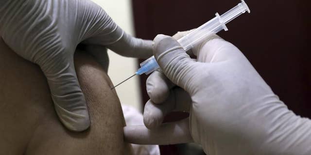  June 16, 2021: A man receives the Sinopharm COVID-19 vaccine at a vaccination center, in Kabul, Afghanistan.