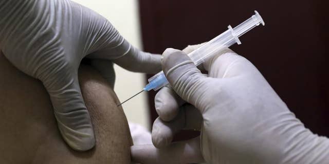 June 16, 2021: A man receives the Sinopharm COVID-19 vaccine at a vaccination center, in Kabul, Afghanistan.