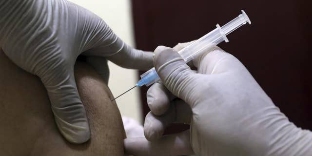  June 16, 2021: A man receives the Sinopharm COVID-19 vaccine at a vaccination center, in Kabul, Afghanistan.