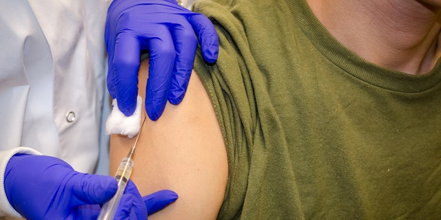 A person is injected with a coronavirus vaccine.
