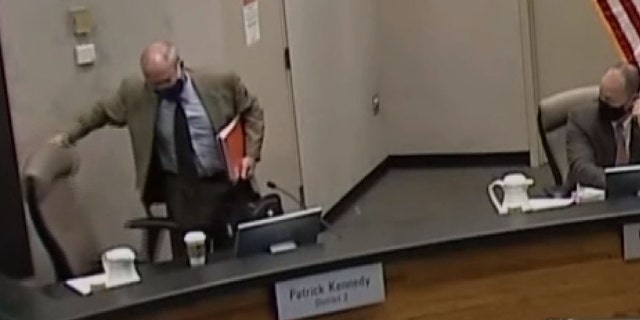Supervisor Patrick Kennedy opts to finish the county board meeting from his office Tuesday after voicing frustration with audience members not wearing masks, a violation of the chamber.