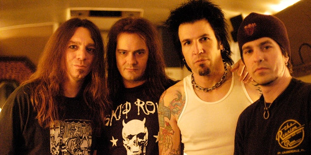 Rock band Skid Row (L-R) Scott Hill, Johnny Solinger, Phil Varone, Rachel Bolan pose for a portrait at the Whisky a Go Go  in Los Angeles, California on March 10, 2004.
