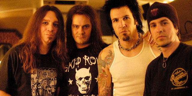 Rock band Skid Row (L-R) Scott Hill, Johnny Solinger, Phil Varone, Rachel Bolan pose for a portrait at the Whisky a Go Go  in Los Angeles, California on March 10, 2004.