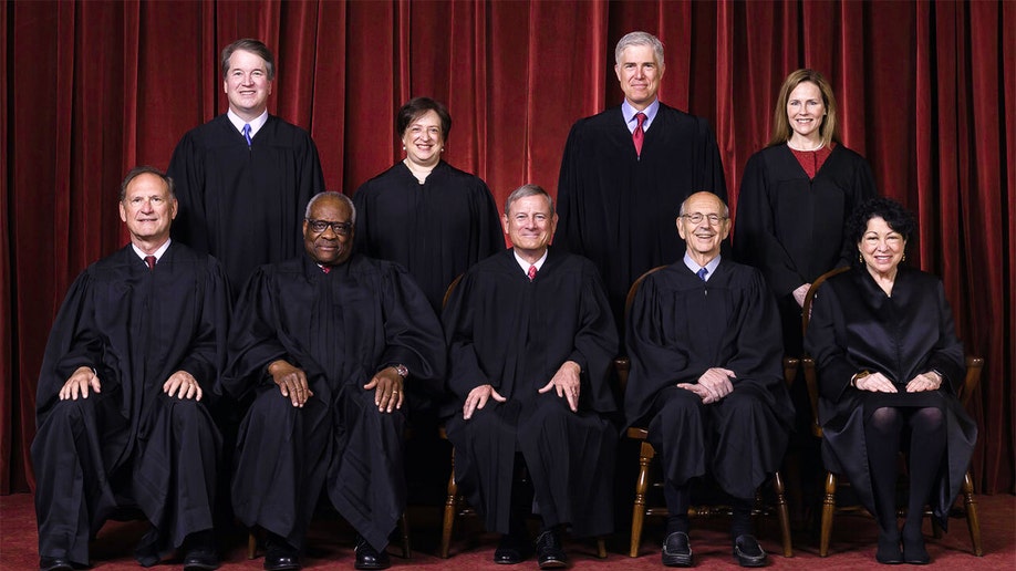 On this April 23, 2021, members of the Supreme Court pose for a group photo at the Supreme Court in Washington.