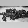 D-Day forces enter the water from docked war ships