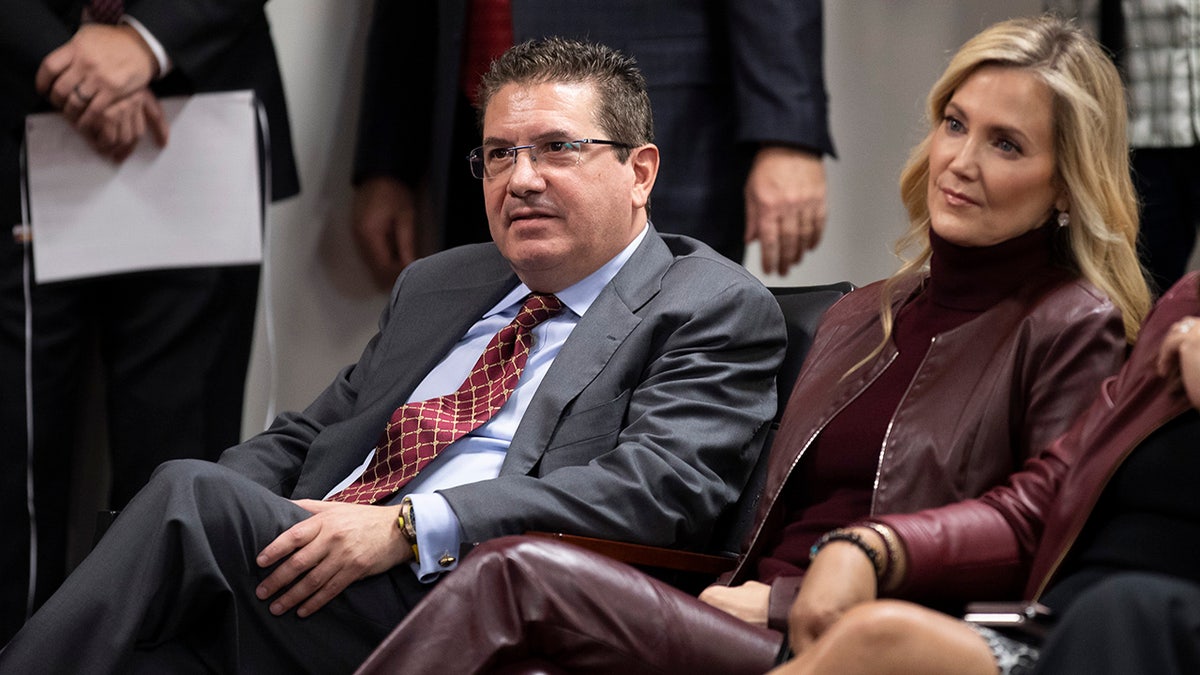 Former Washington Redskins owner Dan Snyder and his wife Tanya at a 2021 news conference.