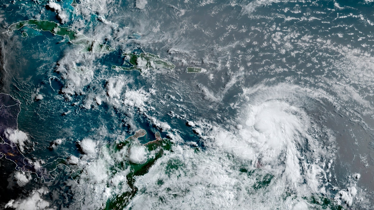 This satellite image provided by the National Oceanic and Atmospheric Administration shows Hurricane Elsa moving through the Caribbean, over Barbados, Tuesday, July 2, 2021, at 12:00 Z (8am a.m. ET). Elsa was expected to pass near the southern coast of Hispaniola on Saturday and to move near Jamaica and portions of eastern Cuba on Sunday. (NOAA/NESDIS/STAR GOES via AP)