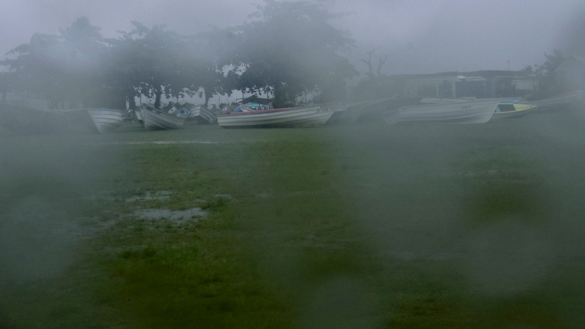 Fishing boats sit offshore to protect them from damage as Hurricane Elsa approaches Call Calliaqua, St. Vincent, Friday, July 2, 2021. (AP Photo/Orvil Samuel)