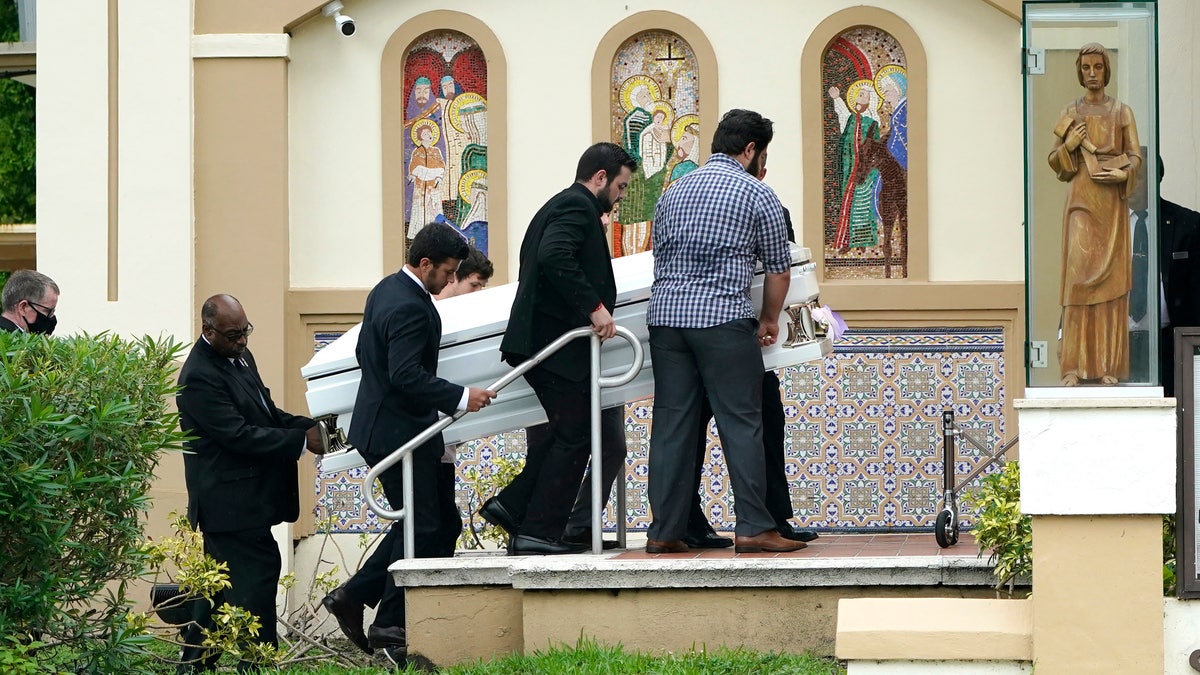 Pallbearers carry the casket of Marcus Guara's daughters before a funeral service for the family at St. Joseph Catholic Church, Tuesday, July 6, 2021, in Miami Beach, Fla. Guara, his wife Anaely, and daughters Lucia and Emma, died in the collapse of the Champlain Towers South condominium building in nearby Surfside. (AP Photo/Lynne Sladky)