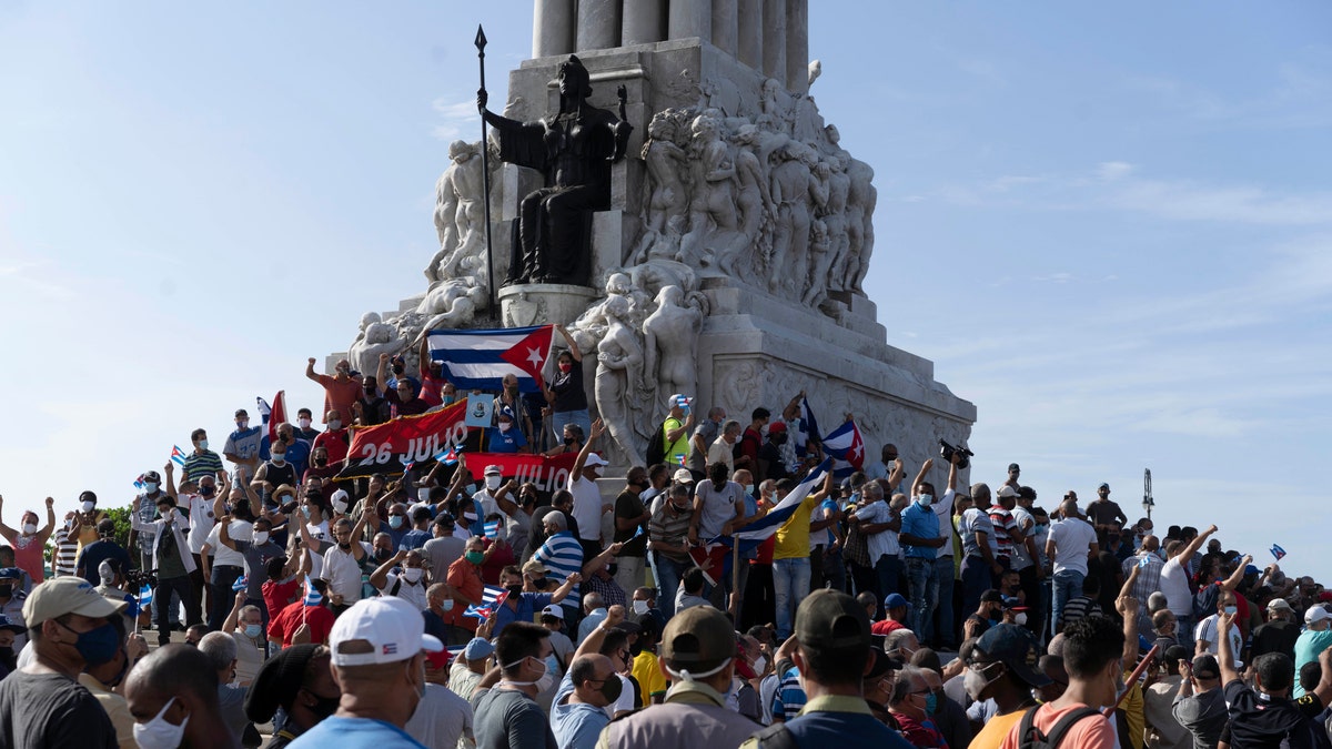 Anti-government protesters gather at the Maximo Gomez monument in Havana, Cuba, Sunday, July 11, 2021. Hundreds of demonstrators took to the streets in several cities in Cuba to protest against ongoing food shortages and high prices of foodstuffs. 