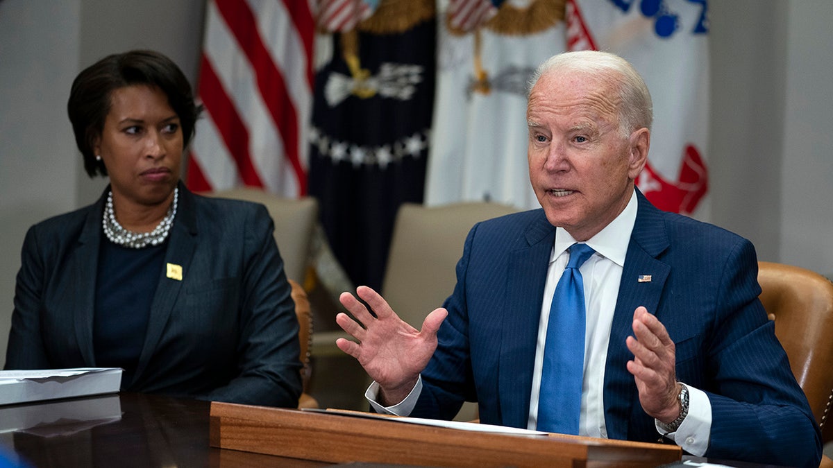 Washington Mayor Muriel Bowser listens as President Joe Biden speaks during a meeting on reducing gun violence, in the Roosevelt Room of the White House, Monday, July 12, 2021, in Washington. (AP Photo/Evan Vucci)