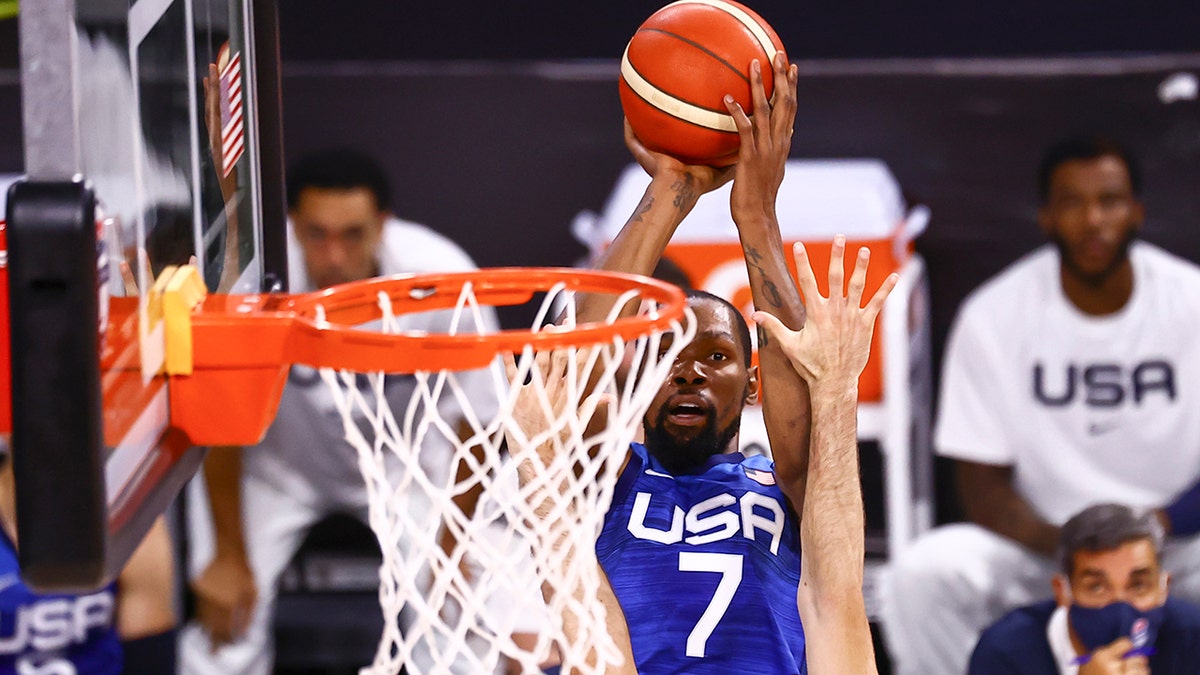 United States' Kevin Durant (7) shoots over Argentina's Patricio Garino during the first half of an exhibition basketball game in Las Vegas on Tuesday, July 13, 2021.