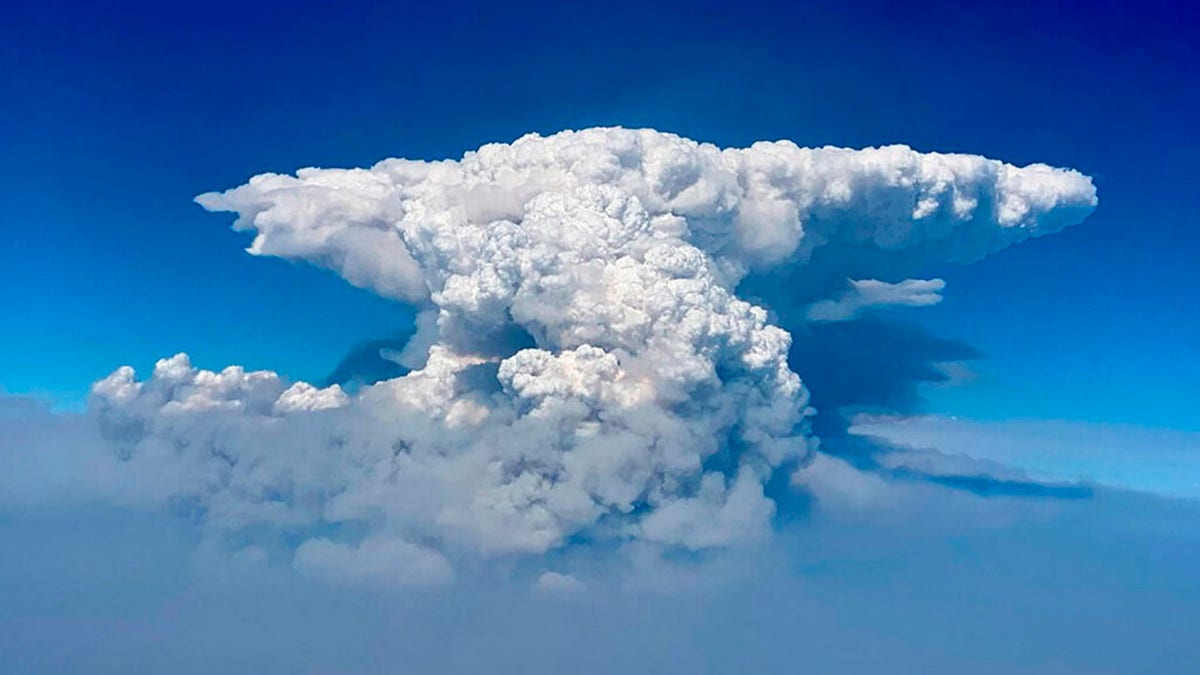 In this photo taken with a drone provided by the Bootleg Fire Incident Command, a pyrocumulus cloud, also known as a fire cloud, is seen over the Bootleg Fire in southern Oregon on Wednesday, July 14, 2021. (Bootleg Fire Incident Command via AP)