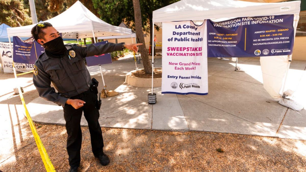 vaccine clinic security guard gives directions