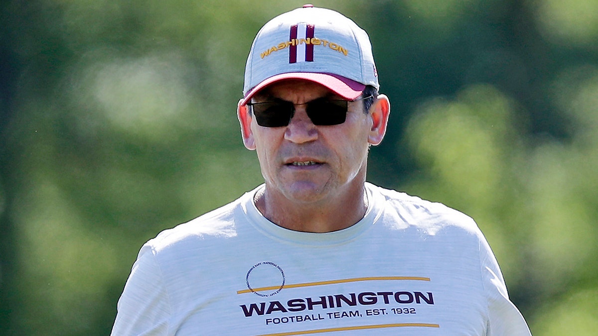 In this May 15, 2021, file photo, Washington Football Team head coach Ron Rivera watches during an NFL football rookie minicamp at Inova Sports Performance Center in Ashburn, Virginia. (AP Photo/Luis M. Alvarez, File)