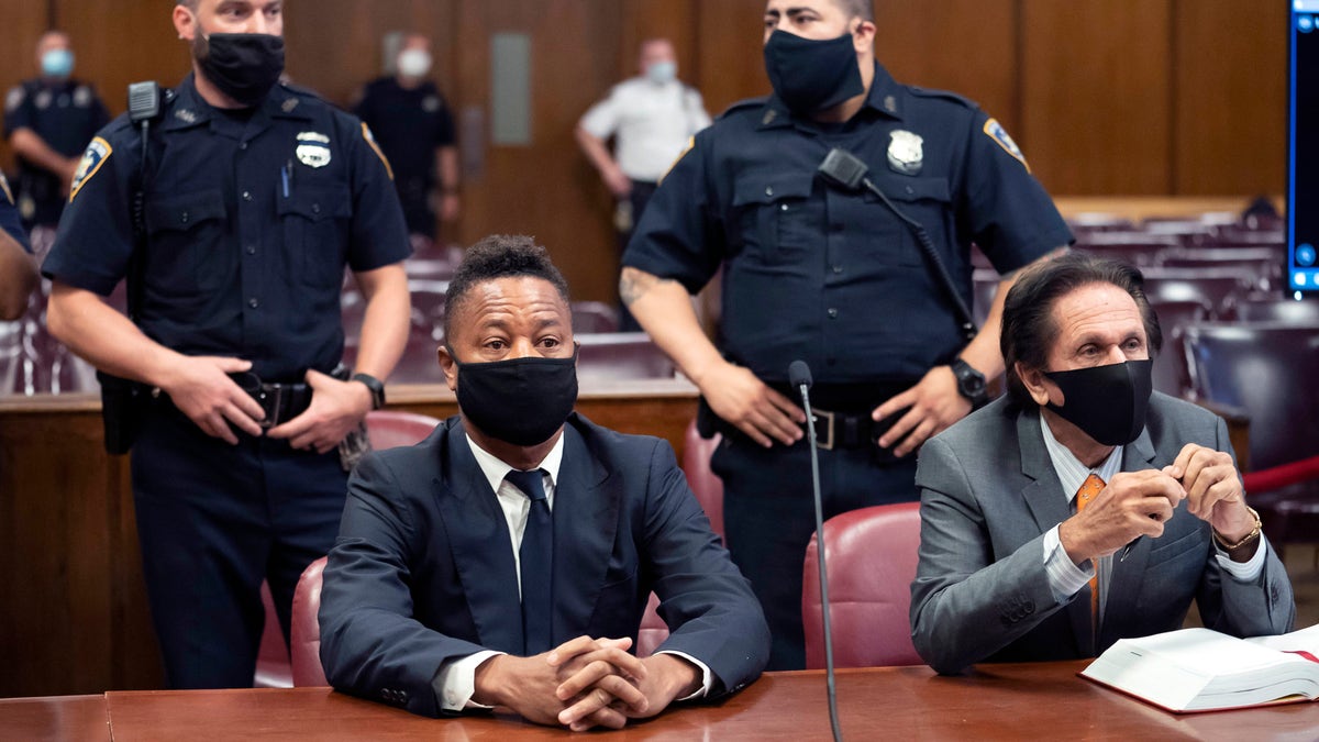 FILE - In this Aug. 13, 2020 file photo, Cuba Gooding Jr., front left, sits at the defense table with his lawyer Marc Heller, during a hearing in his sexual misconduct case in New York. (Steven Hirsch/New York Post via AP, Pool, File)