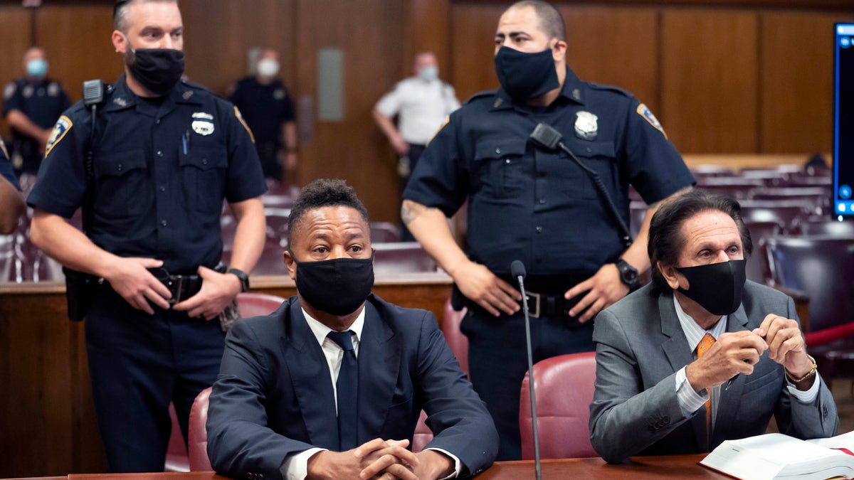 FILE - In this Aug. 13, 2020 file photo, Cuba Gooding Jr., front left, sits at the defense table with his lawyer Marc Heller, during a hearing in his sexual misconduct case in New York. (Steven Hirsch/New York Post via AP, Pool, File)