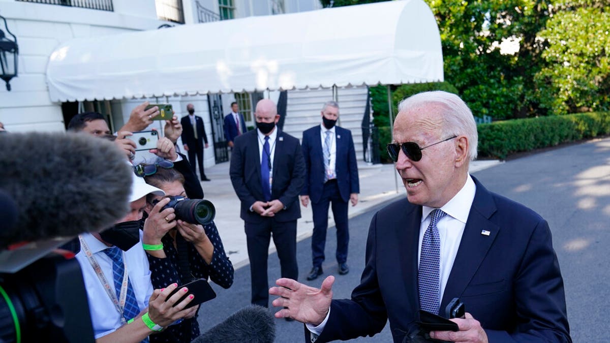 President Joe Biden talks with reporters before boarding Marine One on the South Lawn of the White House in Washington, Friday, July 30, 2021, as he heads Camp David for the weekend. (Associated Press)