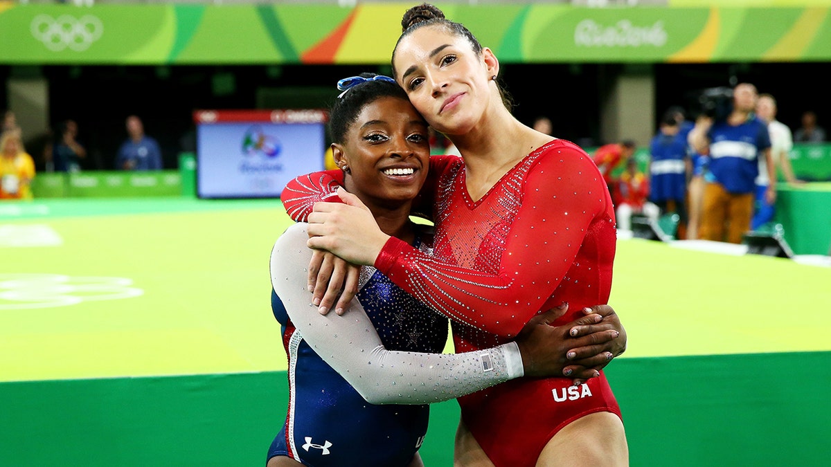 Simone Biles (L) of the United States waits for the score after competing on the floor with Alexandra Raisman (R) during the Women's Individual All Around Final on Day 6 of the 2016 Rio Olympics at Rio Olympic Arena on Aug. 11, 2016 in Rio de Janeiro, Brazil.  (Photo by Alex Livesey/Getty Images)