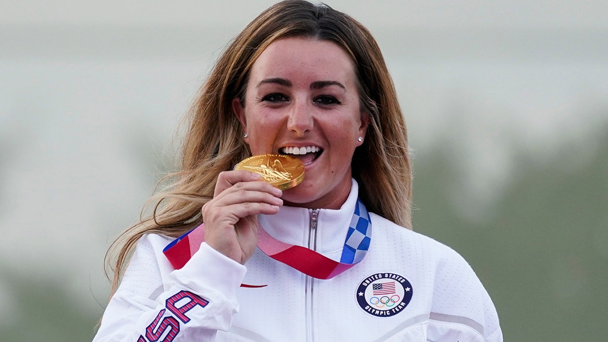 Amber English, of the United States, celebrates with her gold medal in the women's skeet at the Asaka Shooting Range in the 2020 Summer Olympics