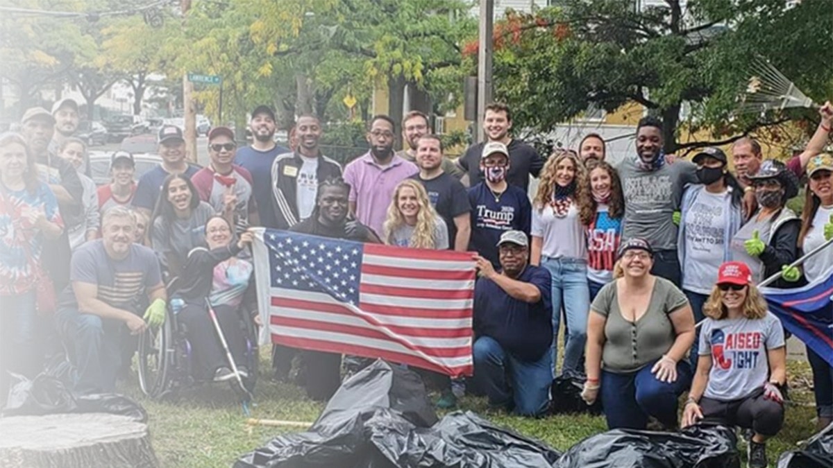 Prempeh and supporters pose behind an American flag at a campaign event in this undated photo.