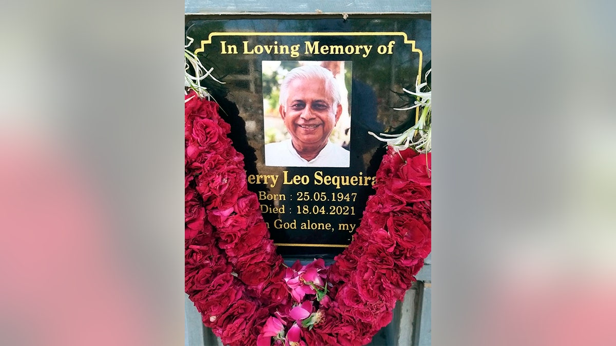 In this photo provided by the Rev. Cedric Prakash, a plaque memorializes the Rev. Jerry Sequeira, who died from the coronavirus on April 18, 2021, in Ahmedabad, India.