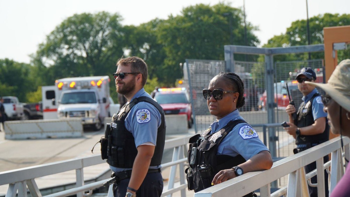 Photo of two Chicago police officers in uniform patrolling streets