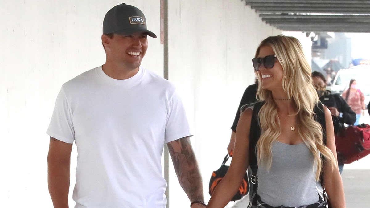 Christina Haack is seen holding hands with Joshua Hall at LAX ahead of their getaway to Mexico to celebrate her 38th birthday.