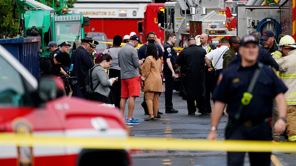 Emergency crews respond after a building under construction collapsed Thursday, July 1, 2021, in Washington. (AP Photo/Carolyn Kaster)