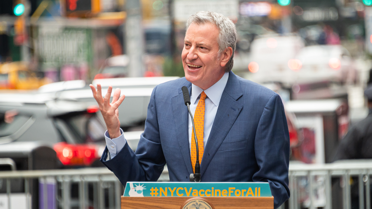 Mayor of New York City Bill de Blasio attends the opening of a vaccination center for Broadway workers in Times Square on April 12, 2021 in New York City. De Blasio and his top health officials Wednesday were reluctant to re-implement a mask mandate without data from the CDC to support its new guidelines. 