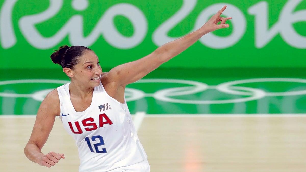 FILE - United States' Diana Taurasi celebrates after making a three-point basket during the gold medal basketball game against Spain at the 2016 Summer Olympics in Rio de Janeiro, Brazil, in this Saturday, Aug. 20, 2016, file photo. Sue Bird and Diana Taurasi will try and become the first five-time Olympic gold medalists in basketball as they lead the U.S women's team at the Tokyo Games. The duo was selected for their fifth Olympics on Monday, June 21, 2020, joining Teresa Edwards as the only basketball players in U.S. history to play in five.(AP Photo/Charlie Neibergall, File)