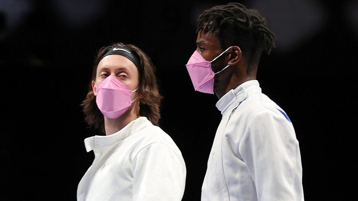 Jacob Hoyle of Team United States, left, and Curtis McDowald of Team United States react to their loss to Team Japan in Men's Épée Team Table of 16 on day seven of the Tokyo 2020 Olympic Games at Makuhari Messe Hall on July 30, 2021 in Chiba, Japan. (Photo by Elsa/Getty Images)