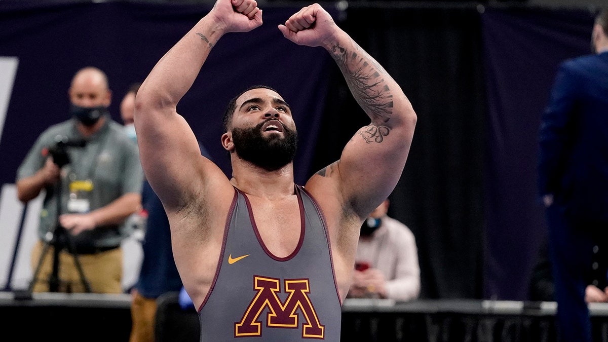 FILE - Minnesota's Gable Steveson celebrates after defeating Michigan's Mason Parris in their 285-pound match in the finals of the NCAA wrestling championships in St. Louis, in this Saturday, March 20, 2021.