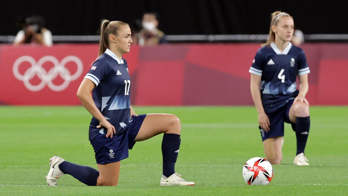 Britain's Georgia Stanway and Keira Walsh take a knee