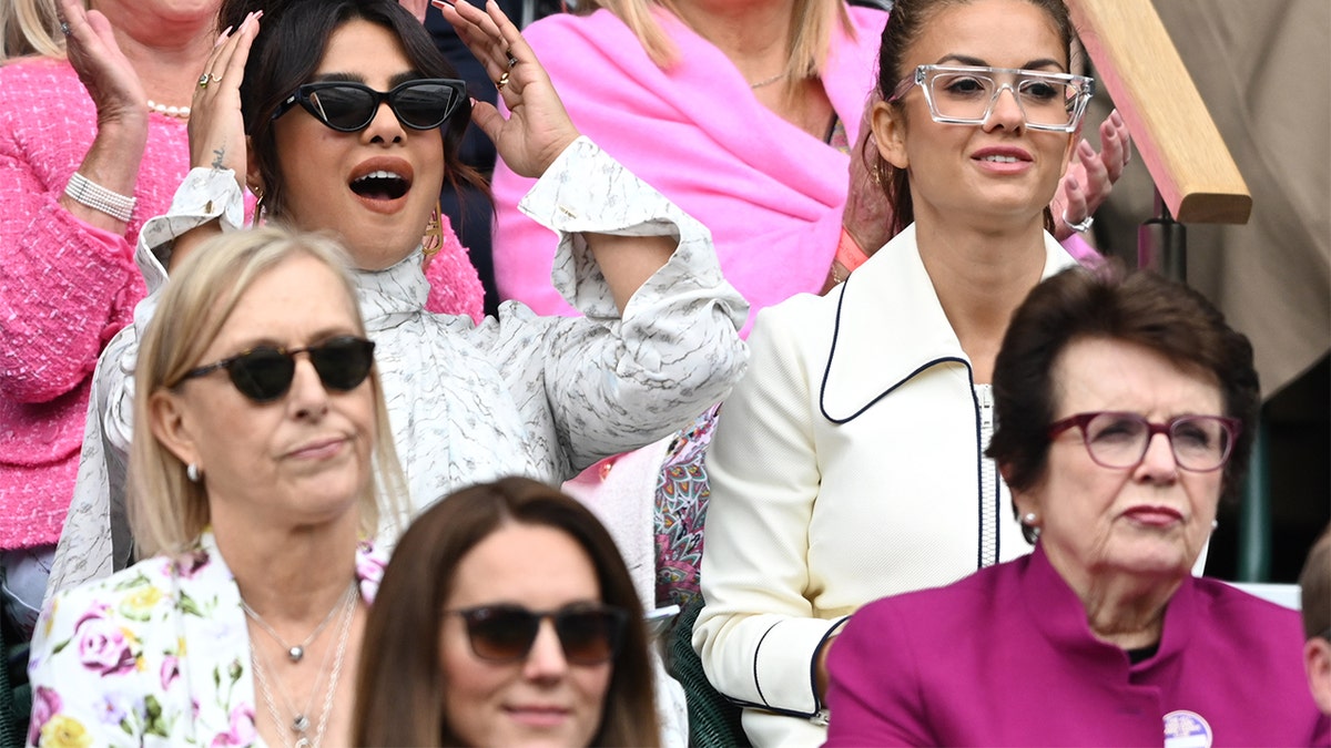 Priyanka Chopra attends day 12 of the Wimbledon Tennis Championships at the All England Lawn Tennis and Croquet Club on July 10, 2021 in London, England. Seated below with sunglasses is Kate Middleton.