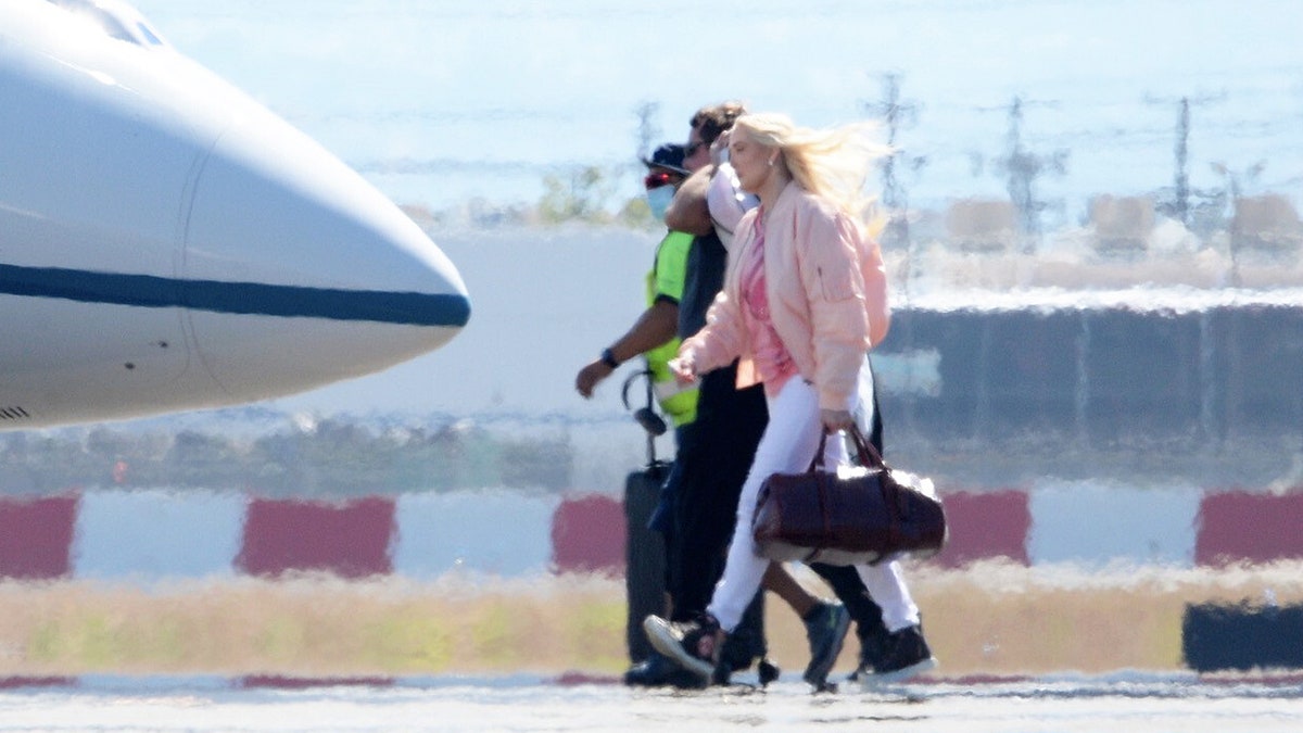 Erika Jayne was spotted boarding a private jet despite her mounting legal and financial troubles.