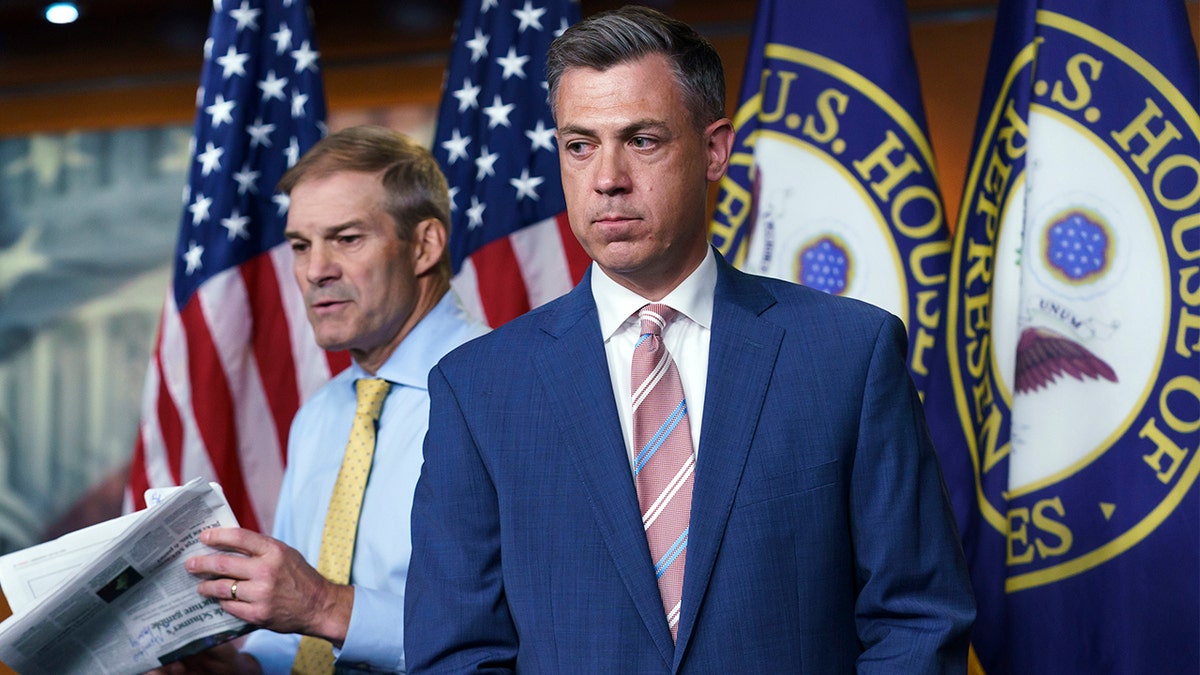 Rep. Jim Banks, R-Ind., center, and Rep. Jim Jordan, R-Ohio, left, exchange places at the podium during a news conference after House Speaker Nancy Pelosi rejected the two who were picked by House Minority Leader Kevin McCarthy, R-Calif., for the committee investigating the Jan. 6 Capitol insurrection at the Capitol in Washington, Wednesday, July 21, 2021.