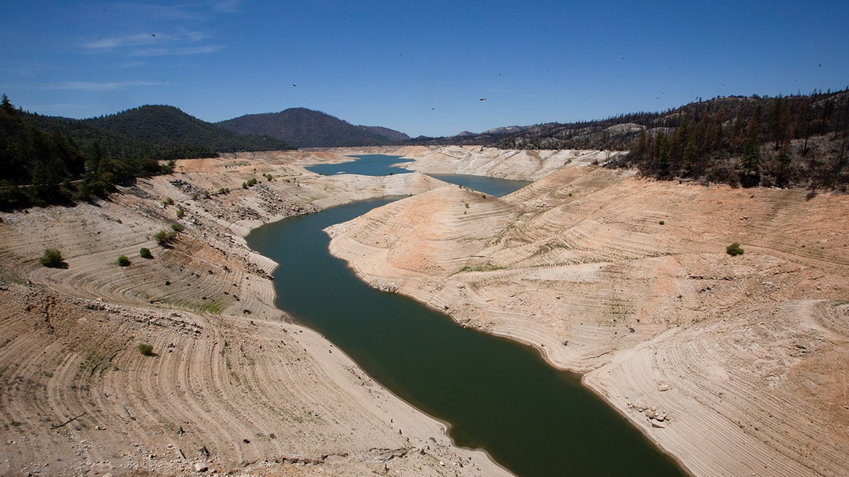 Low water levels are visible at Lake Oroville, which is the second largest reservoir in California and according to daily reports of the state's Department of Water Resources is near 35% capacity, near Oroville, California, U.S., June 16, 2021. Picture taken June 16, 2021. 