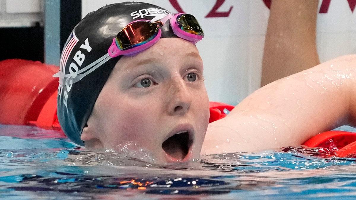 Lydia Jacoby, of the United States, reacts after winning the final of the women's 100-meter breaststroke at the 2020 Summer Olympics, Tuesday, July 27, 2021, in Tokyo, Japan. (AP Photo/Petr David Josek)