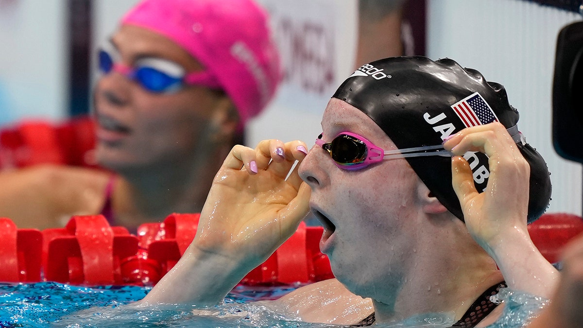 Lydia Jacoby of the United States sees the results after winning the final of the women's 100-meter breaststroke at the 2020 Summer Olympics, Tuesday, July 27, 2021, in Tokyo, Japan. (AP Photo/Martin Meissner)