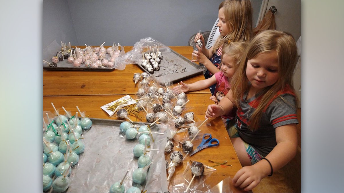 Madsen's daughters' preparing cake pops for the lemonade stand. 