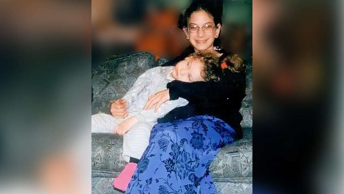 Malki Roth with her youngest sister, Haya, who is severely disabled. 