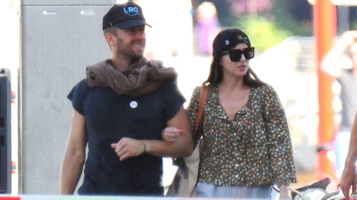 Chris Martin and Dakota Johnson stroll together