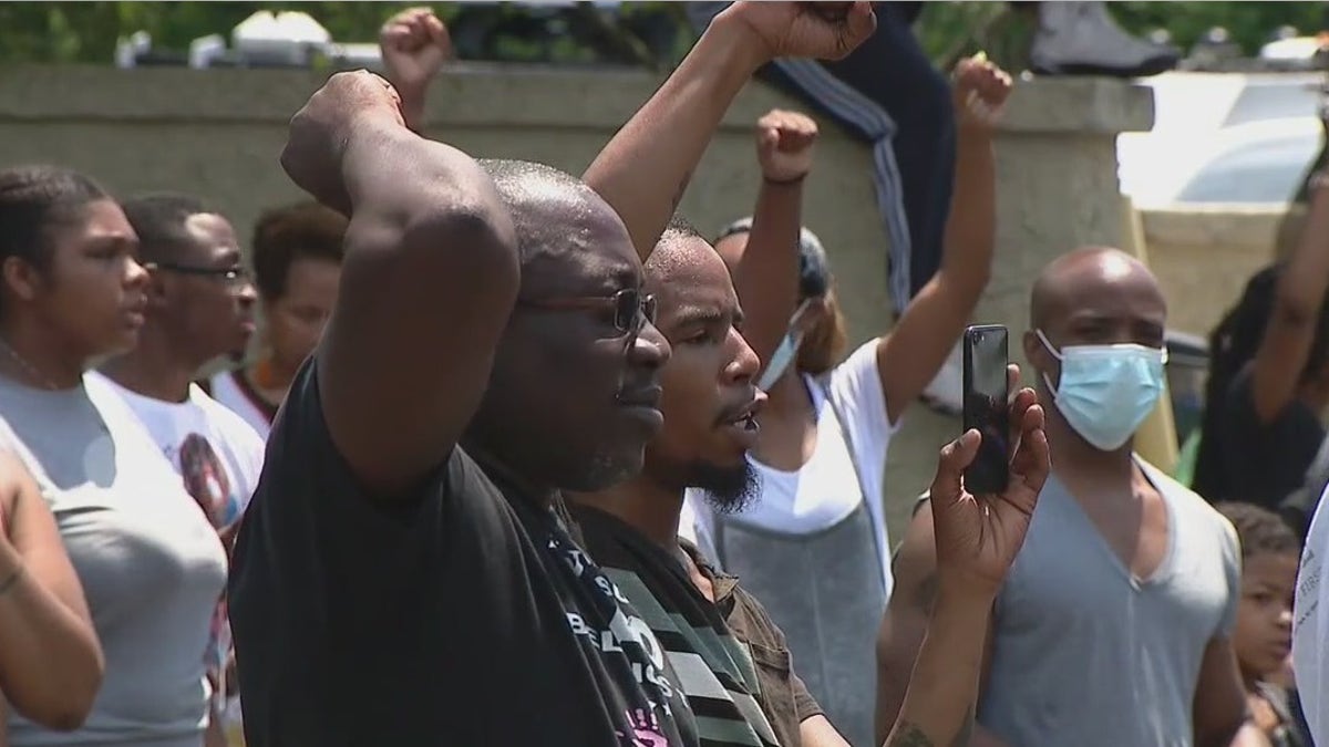 The number of protesters grew to about 100 on Monday.
