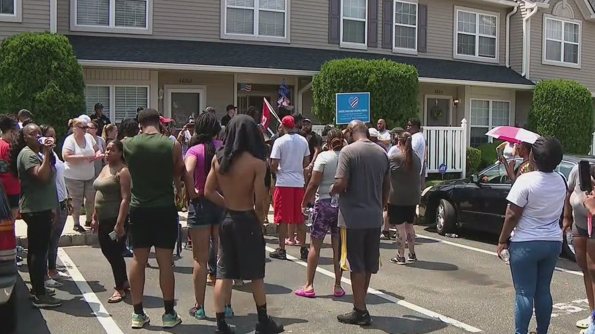 Protesters outside a home in Mt. Laurel, N.J.