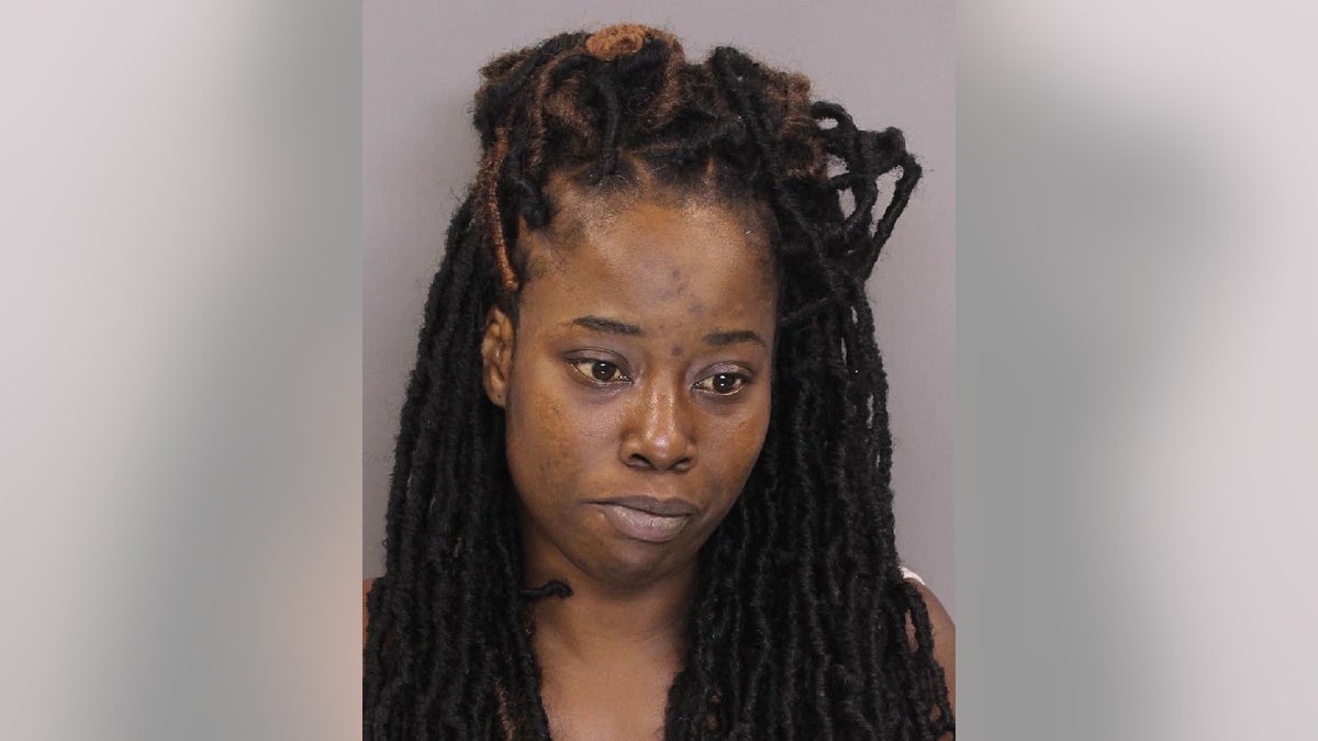 Nicole Johnson, 33, is charged in connection with the deaths of her niece and nephew, who were found dead during a police traffic stop.